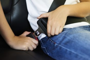 a person putting seatbelt on